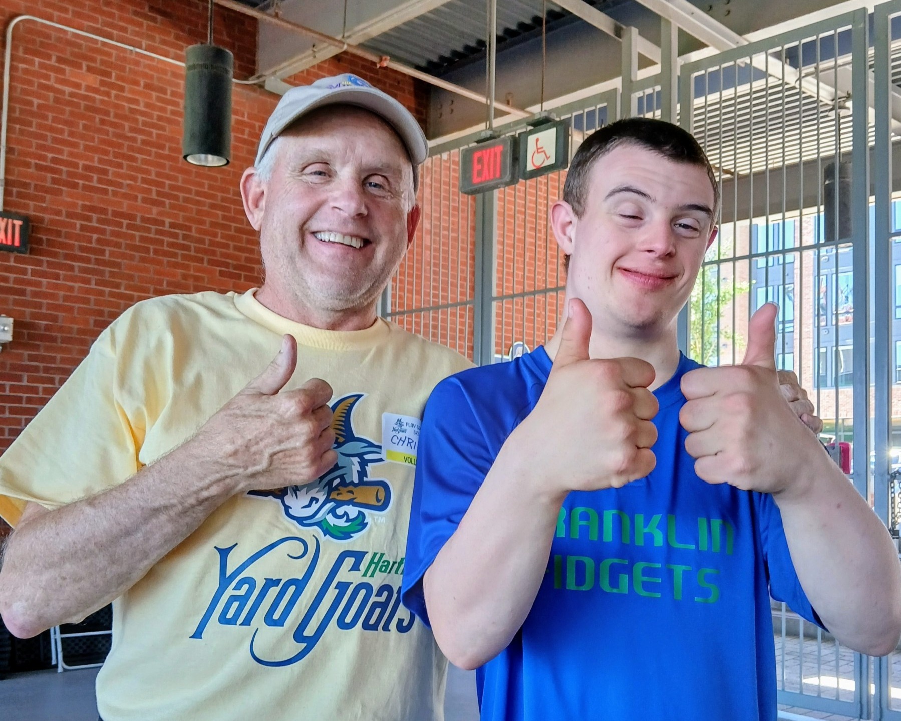 Miracle League of CT executive director, Chris Montross, and youth athlete.