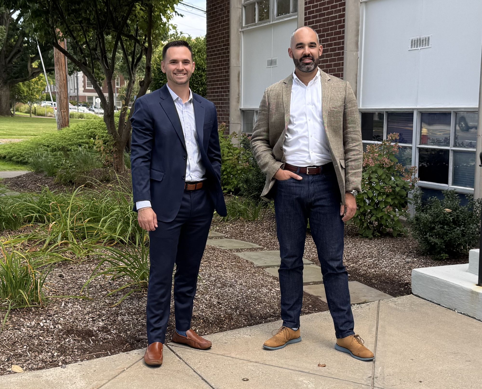 Attorneys Trevor Getek and Aaron Frankel in front of the Franklin & Frankel Office at 68 South Main Street in West Hartford, CT.